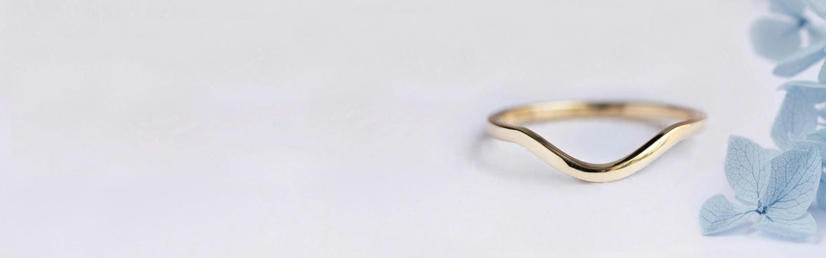 simple white gold curved wedding ring