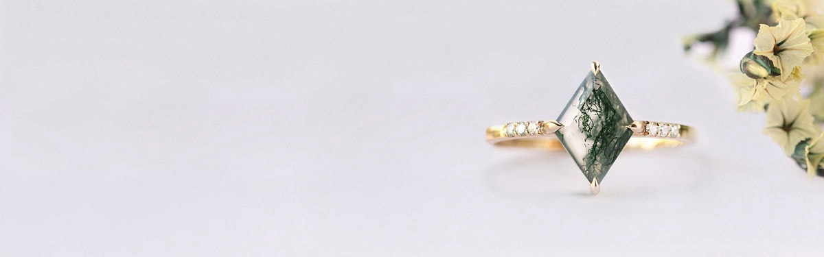 yellow gold moss agate lozenge engagement ring with round diamonds