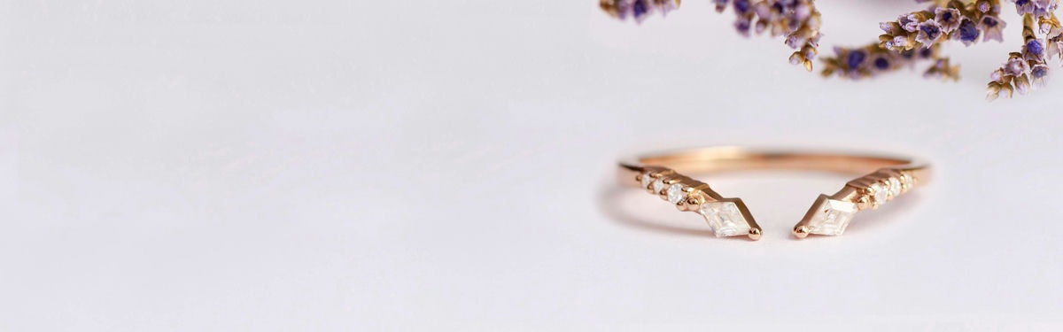 open wedding ring with lozenge moissanite and round diamonds
