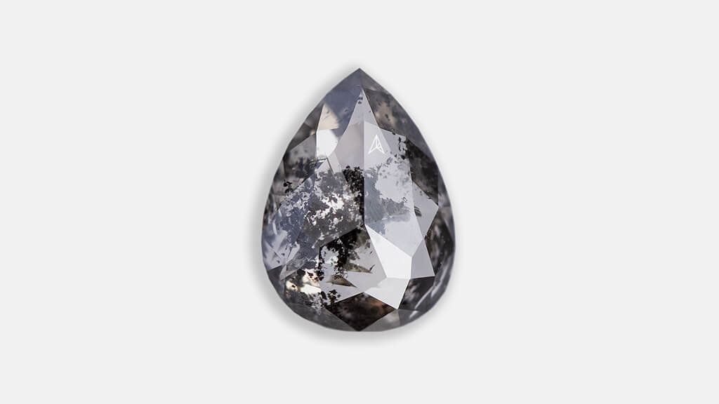 salt and pepper diamond in pear shape dark grey colored with visibile inclusions