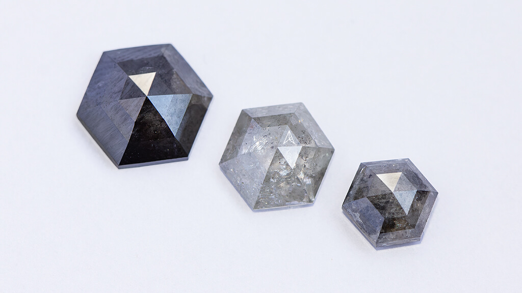 three hexagon shaped diamonds with different sizes and opacity