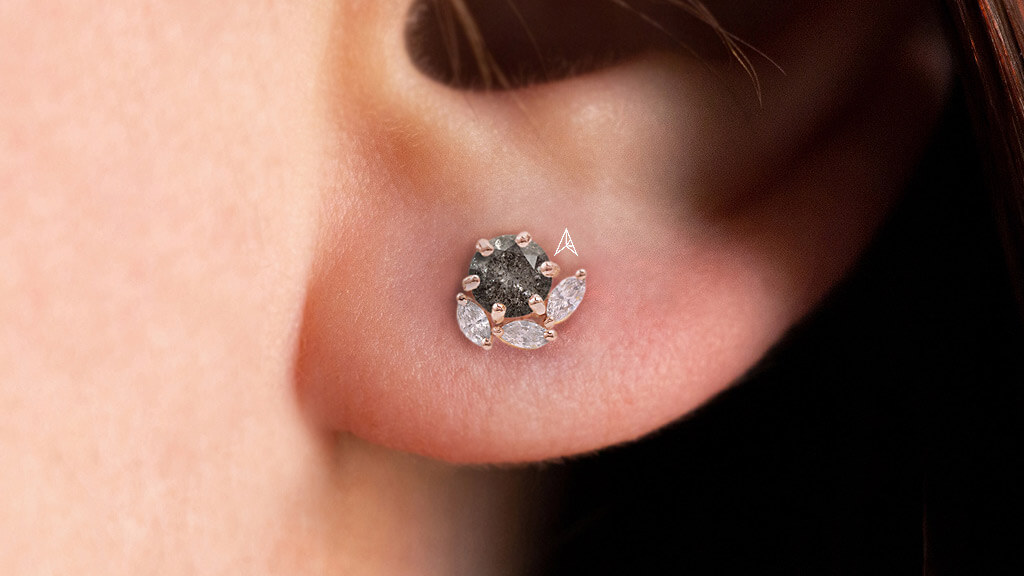 round dark sp diamond with marquise diamonds around on earrings