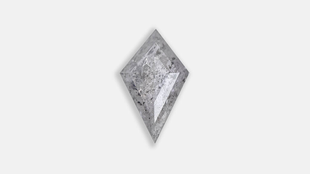 kite shapped salt and pepper diamond in icy white color that features inclusions