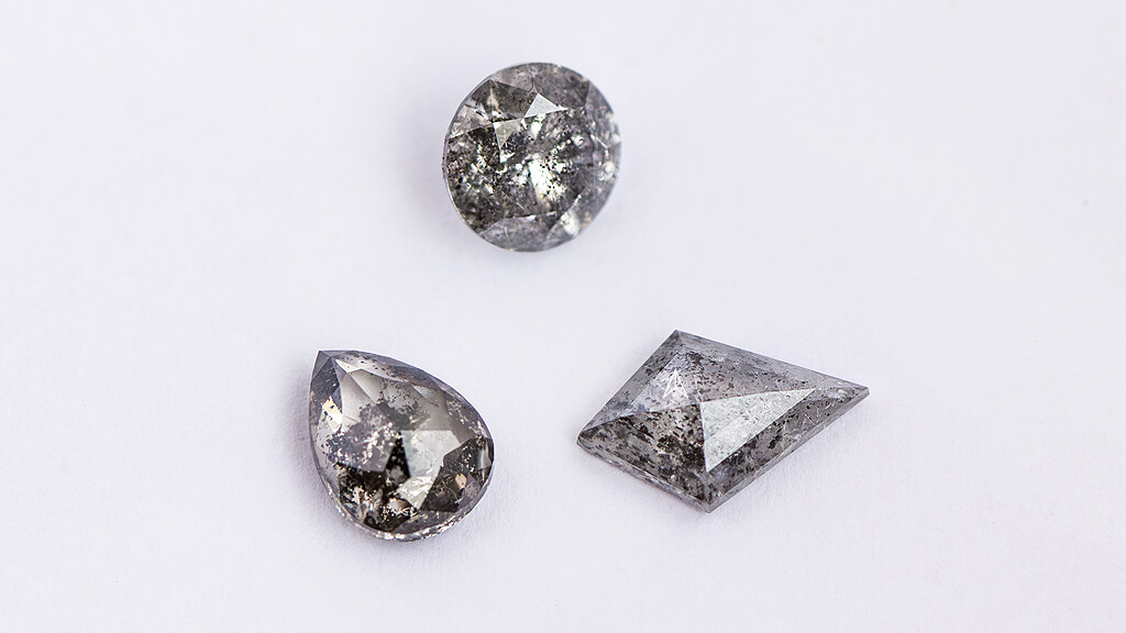pear shaped, round shaped and kite shaped example of salt pepper diamonds