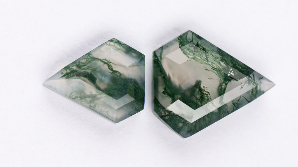 two examples of hard moss agate gemstones