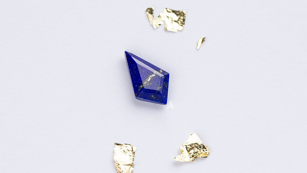 kite lapis gemstone with gold colored inclusions