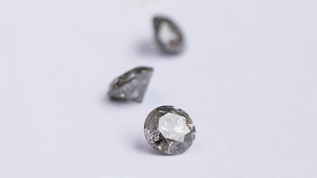 round salt and pepper diamond as an exaple of a stone with inclusions